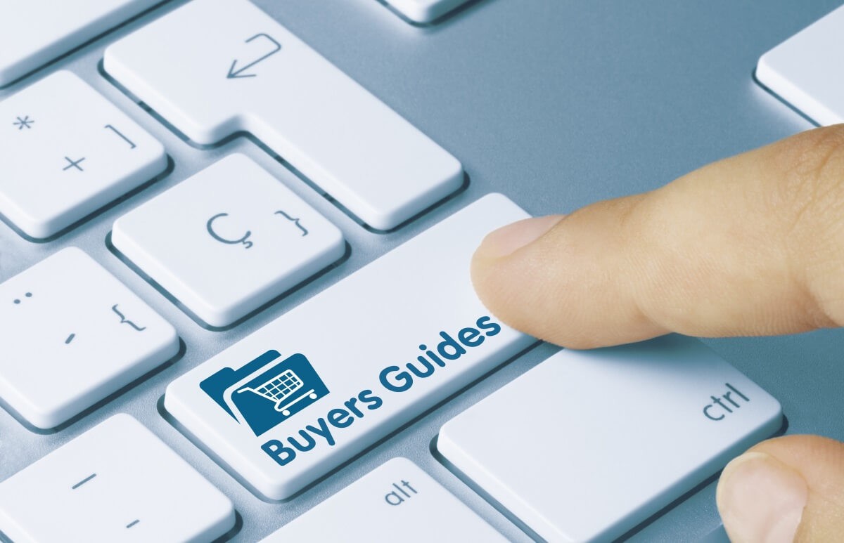 a hand pressing the computer key which says buyers guides