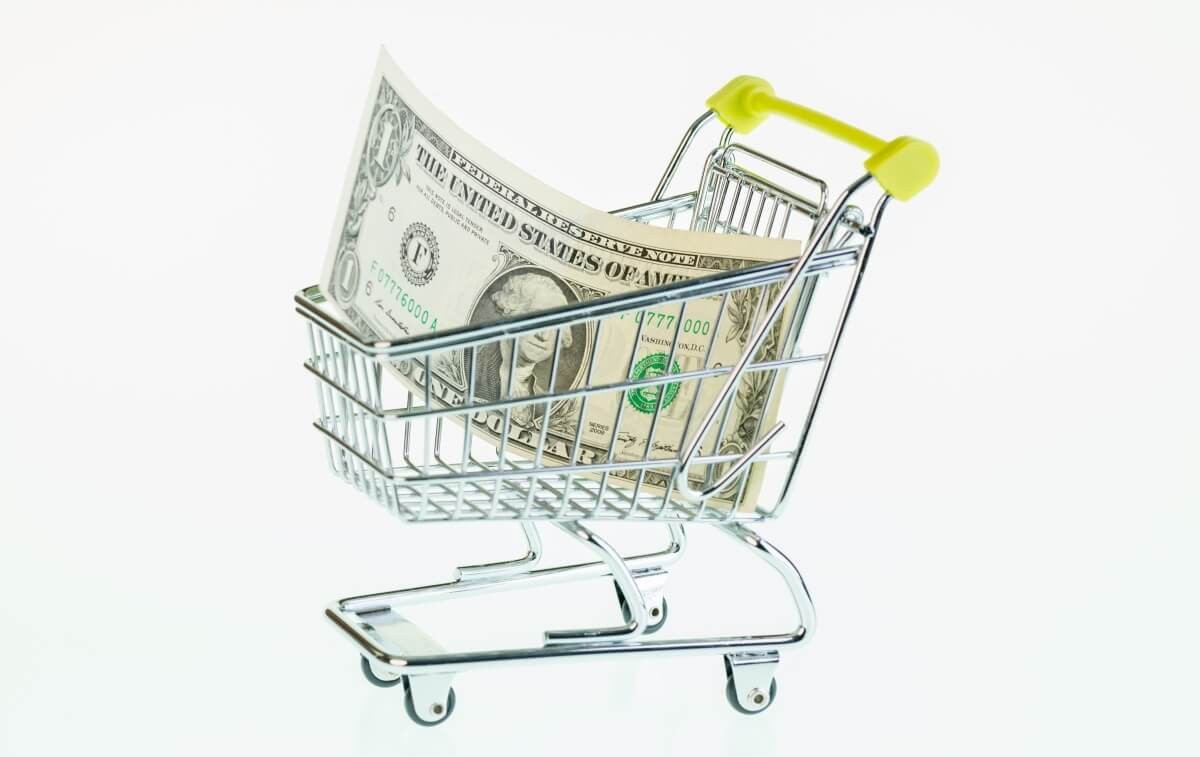 one dollar bill in a shopping cart