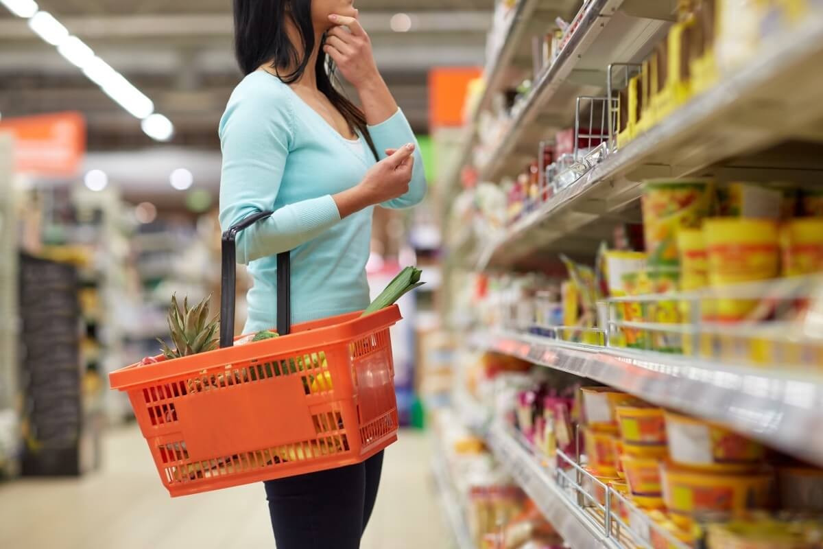 woman with a grocery basket in a supermarket