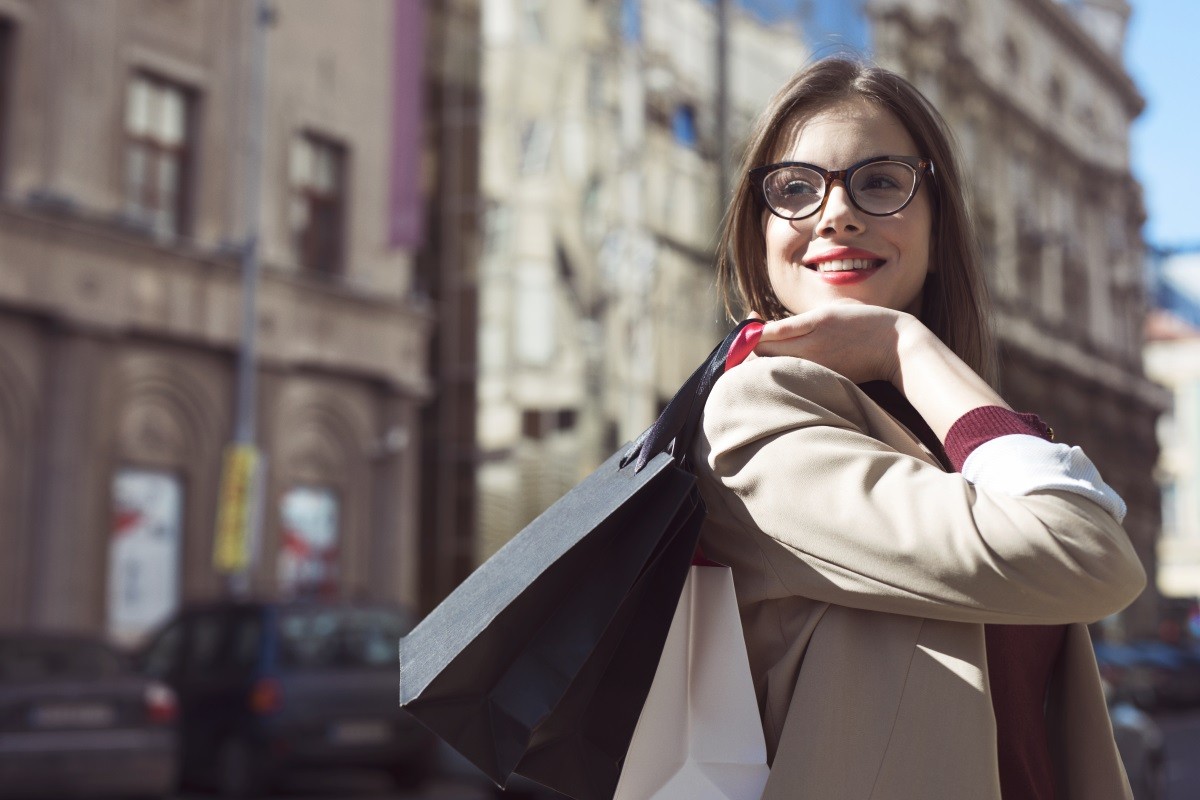 satisfied woman with a shopping bag